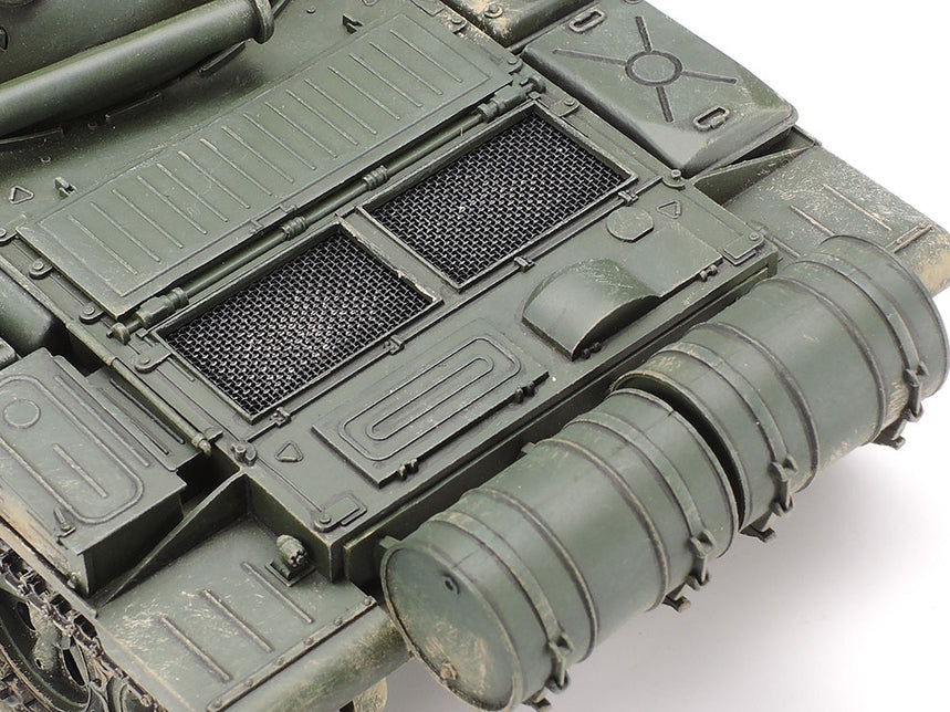 Close-up of a military tank's turret and gun barrel on a white background