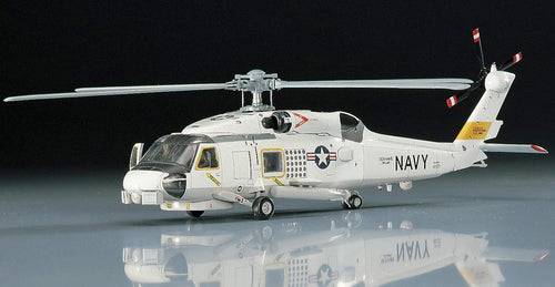 Model helicopter with 'Navy' marking on a reflective surface