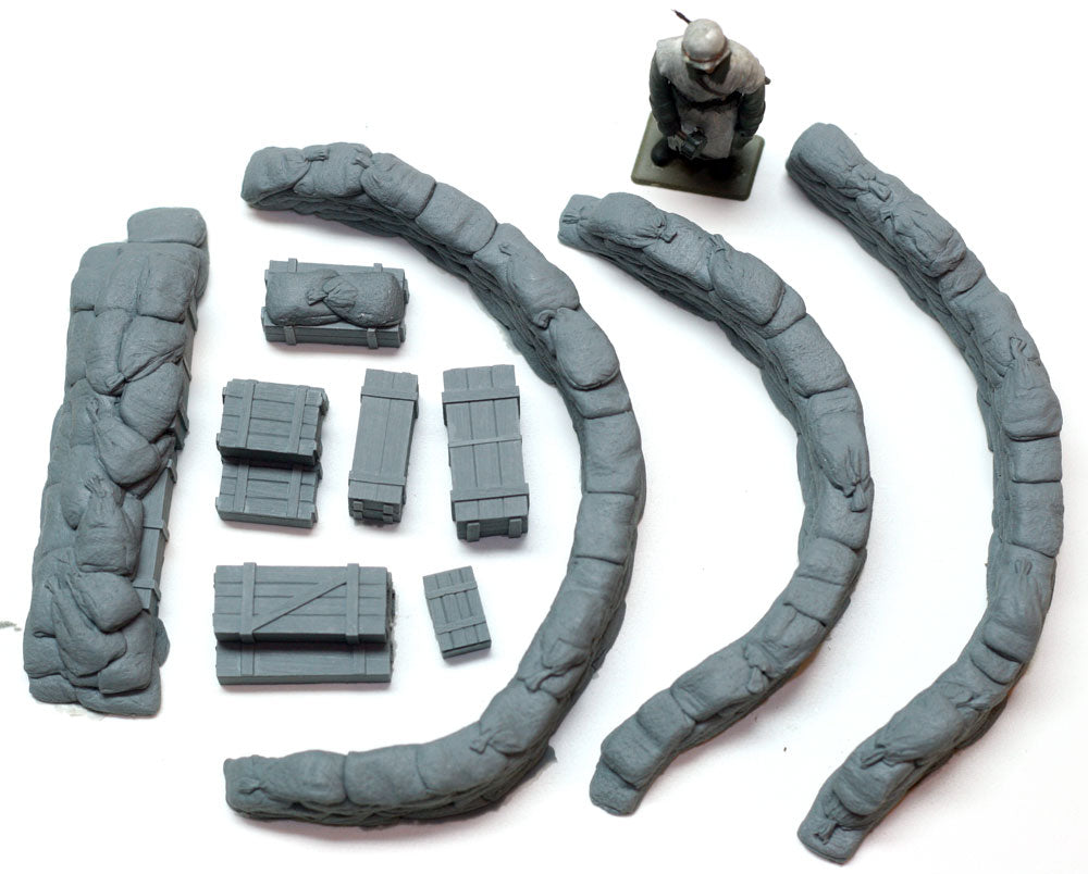 Collection of gray plastic model parts on a white background