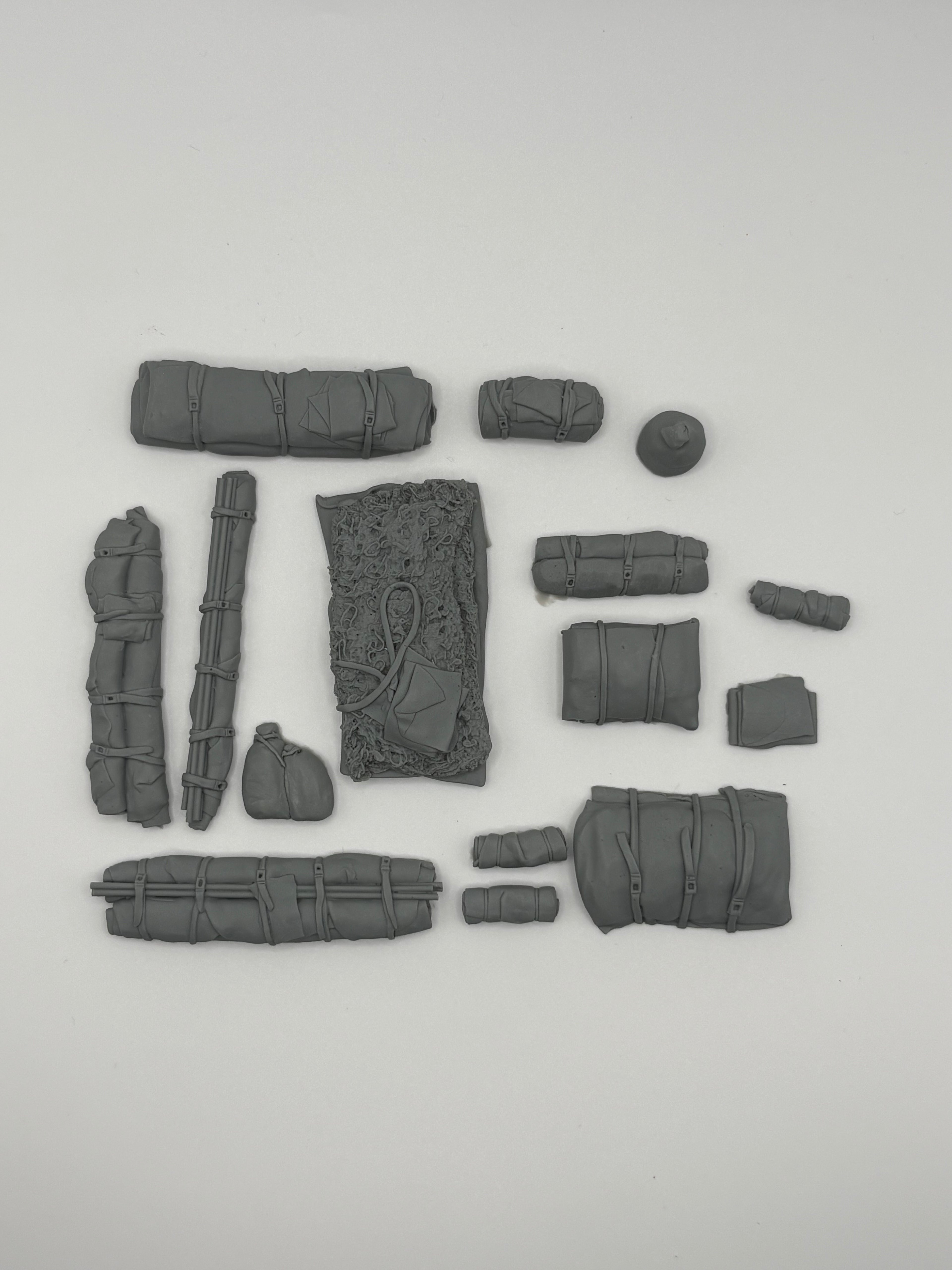 Value Gear 1/35 Universal Stowage Set #29 with resin tarps, bedrolls, cargo bundles, crates, and camouflage net for military model vehicles and dioramas.
