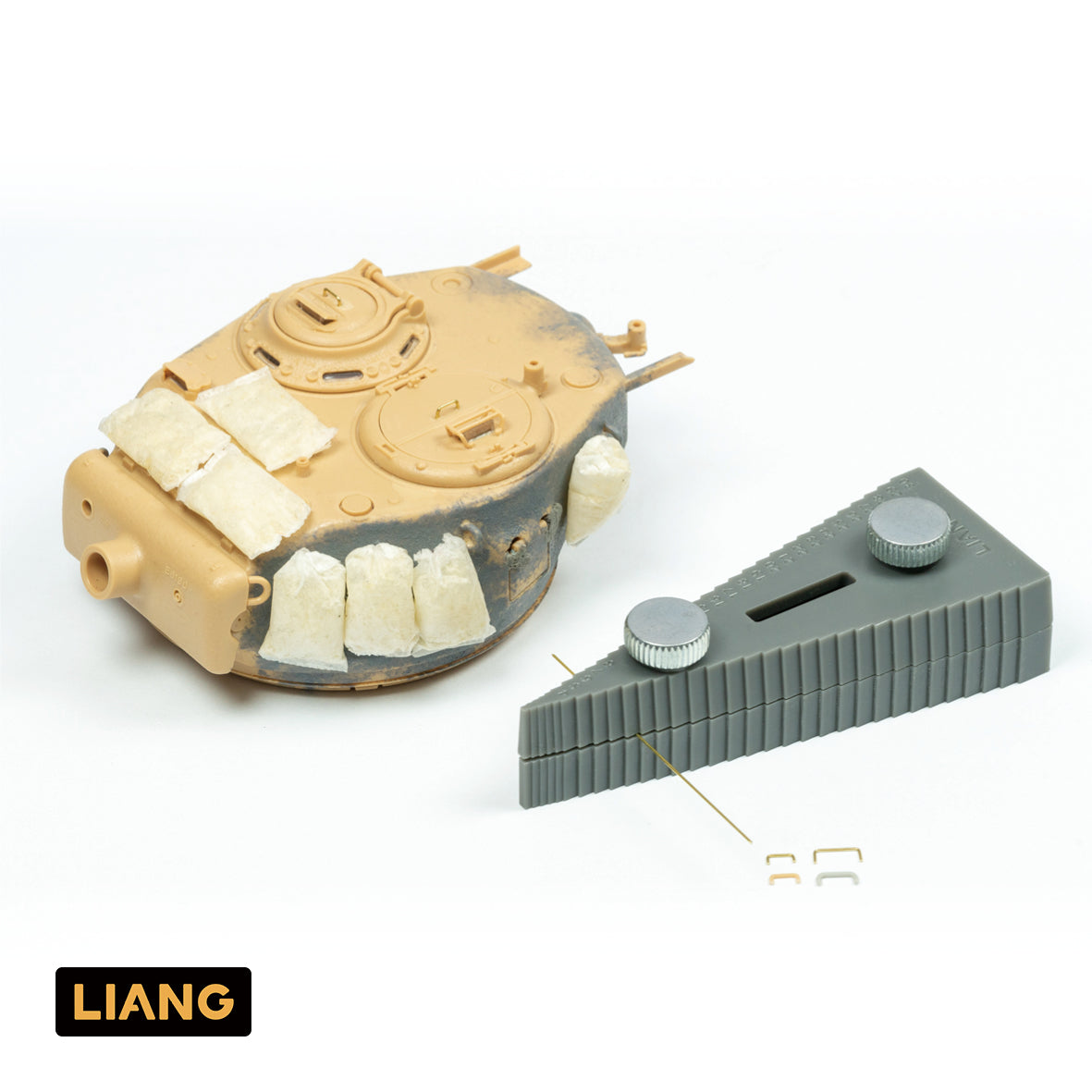 Liang Model LIANG-0235 Handle Bending Tool demonstrated alongside a scale model tank turret with finished metal wire grab handles.