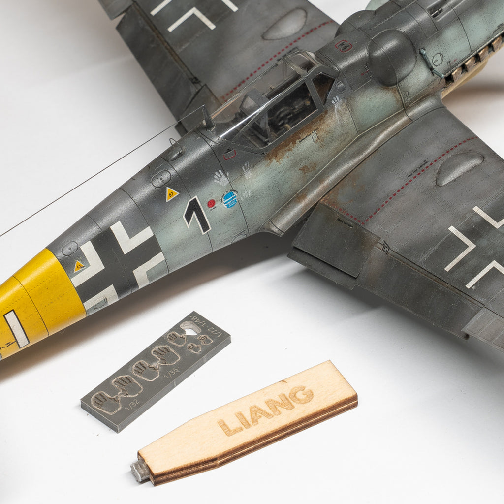 Liang LIANG-0406C Handprint Stamp components shown beside a scale aircraft model, including the rubber stamp and wooden handle.