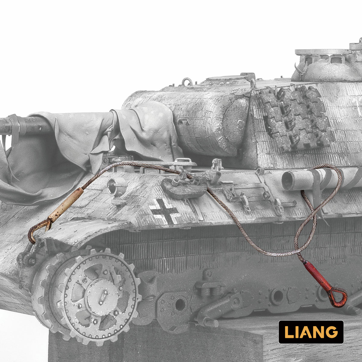 Liang Model 0450E Soft Tow Cable demonstrated installed on a scale German tank, showing its natural drape and realistic braided cable appearance.