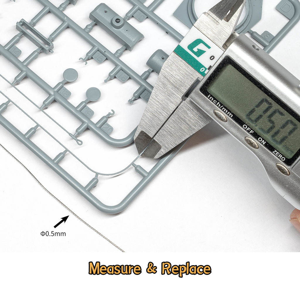 Liang Model Soft Tow Cable being measured against a scale-model part with a digital caliper, demonstrating the fine diameter of the cable.