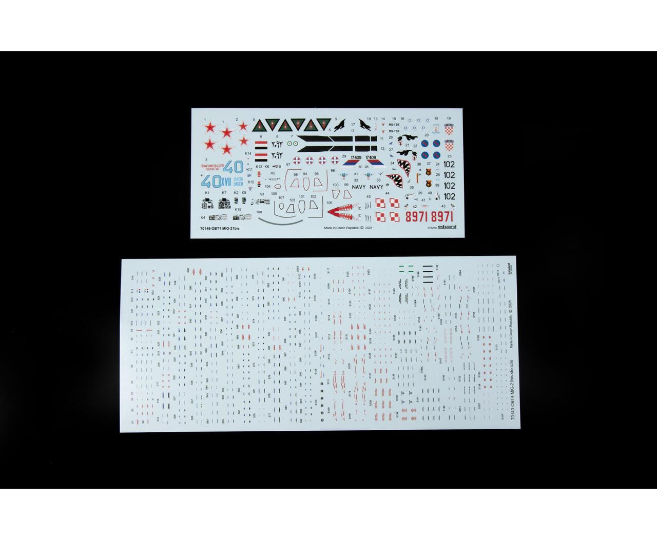 Two sheets of decal stickers with various graphics and text on a black background