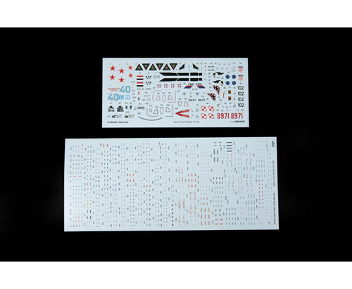 Two sheets of decal stickers with various graphics and text on a black background