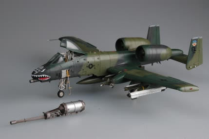 Model of a military aircraft with weapons on a gray background