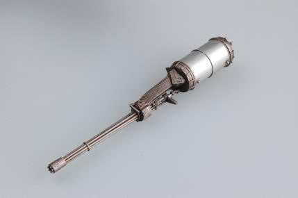 Metallic cylindrical object on a gray background