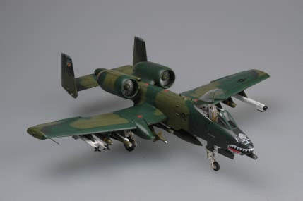 Model of a military aircraft on a gray background