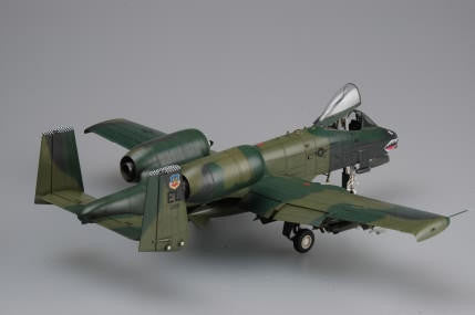 Model of a military aircraft on a gray background
