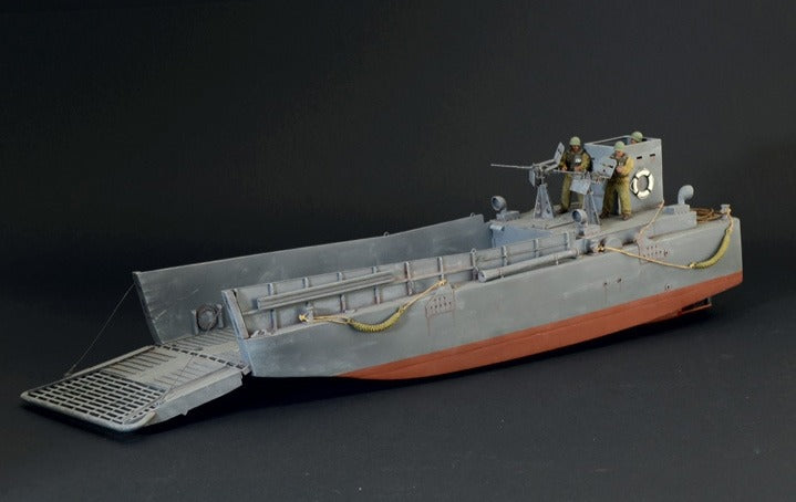 Built Italeri 1/35 LCM 3 landing craft model with lowered bow ramp, machine gun crew figures and grey and red hull