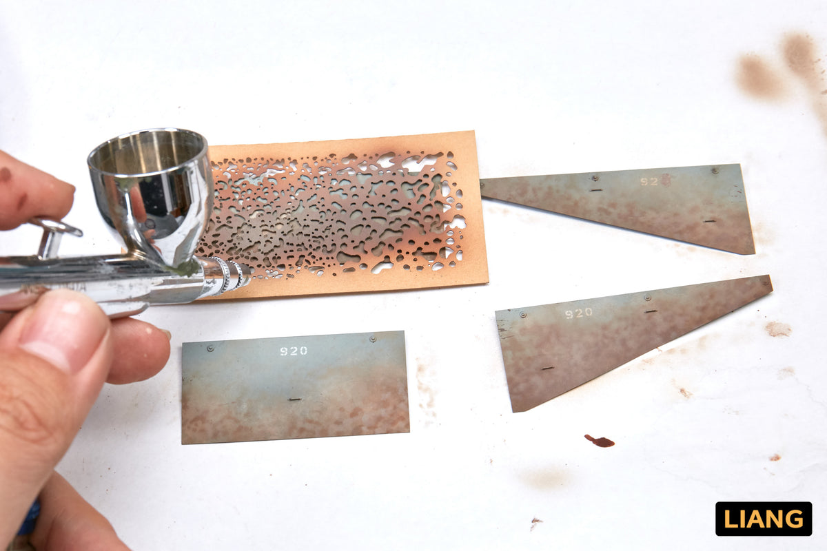 Liang Weathering Airbrush Stencils 0001 stencil sheet with airbrush and weathered model parts