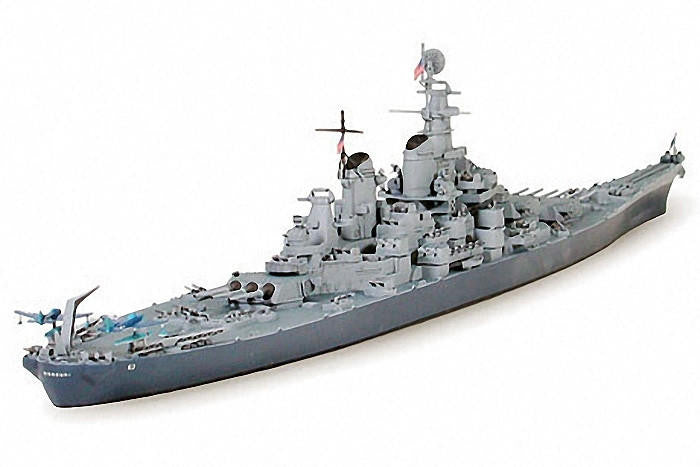 Model of a naval ship on a white background