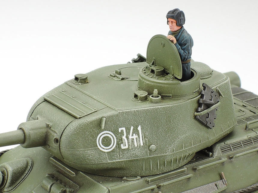 Model tank with a figure inside on a white background