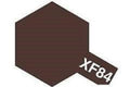 A dark brown hexagonal color swatch with a smaller matching swatch tab labeled XF84 in the lower right corner, on a white background.